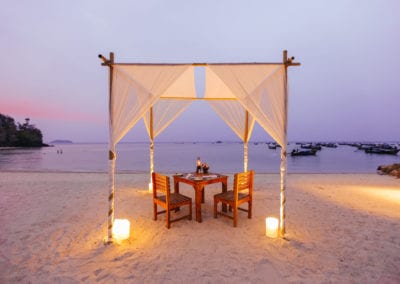 Flight Centre Thailand Dining Table on the beach at dusk